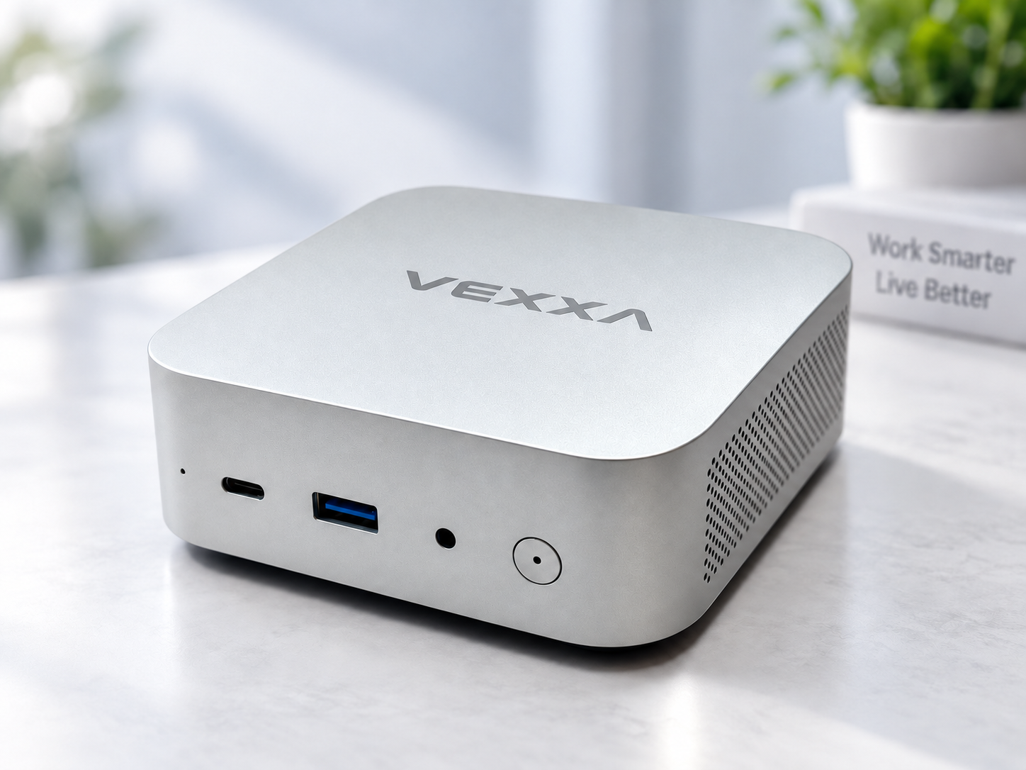 Silver VEXXA Mini PC in a bright workspace